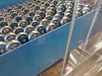 Product elevator roller assembly